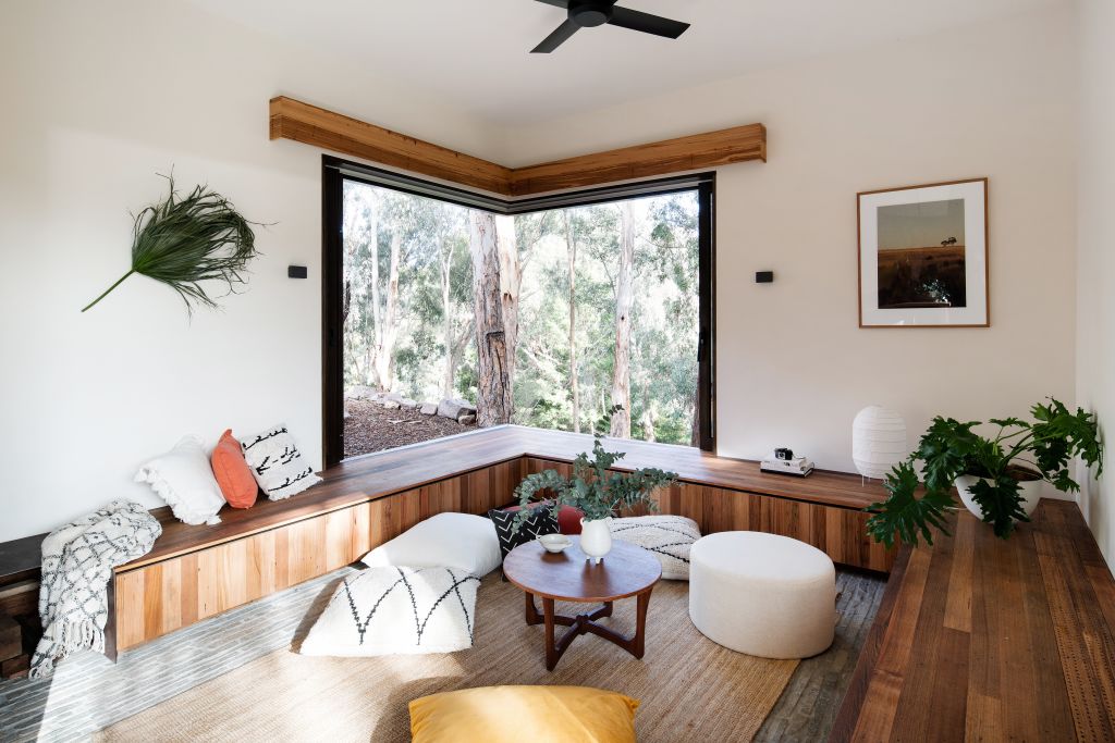 The living 'pod' with custom made bench seating, perfect on a sunny day. Photo: Jellis Craig