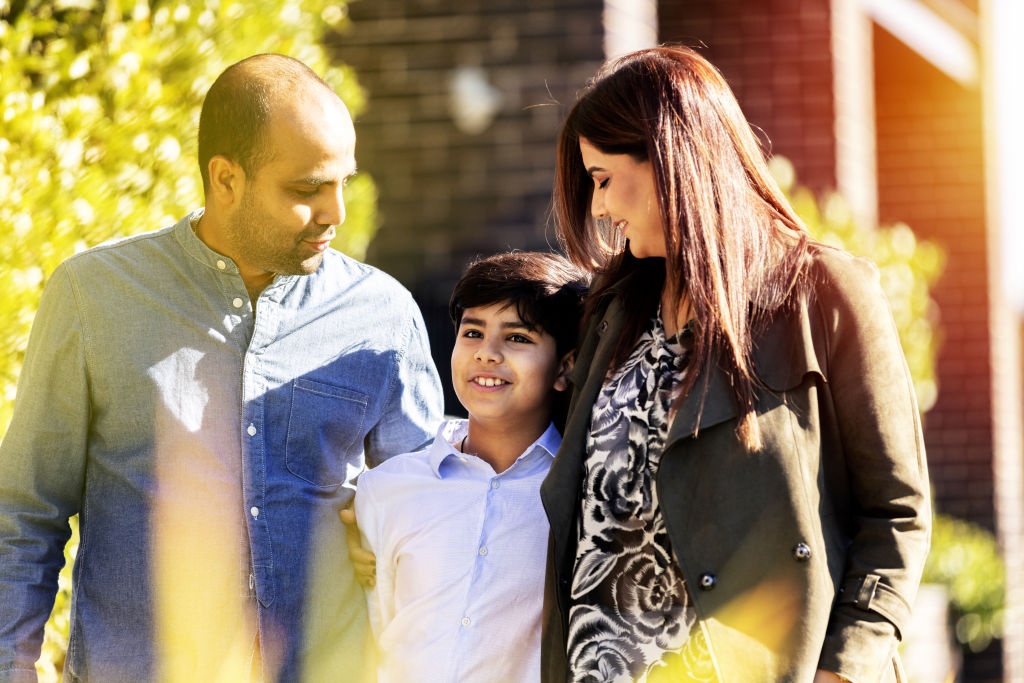LEFT TO RIGHT: Manish with his son Yash and wife Gurveen in Harold Park. Photo: Luc Remond