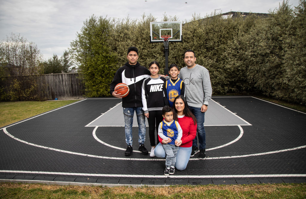 The Kleynhans on their backyard basketball court, which they use frequently. Photo: Leigh Henningham