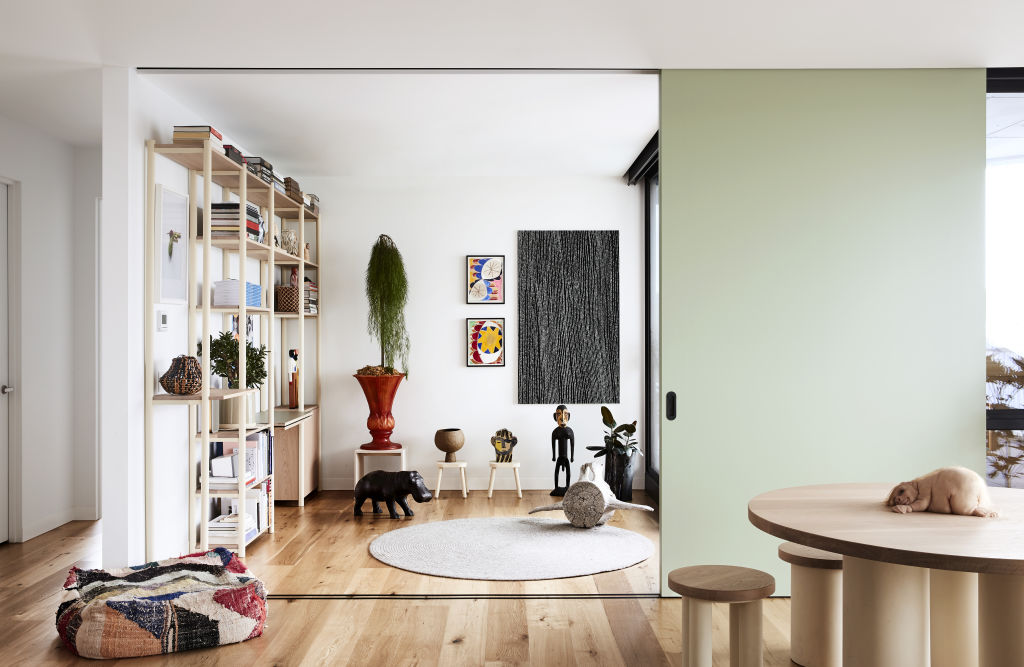 A clever sliding door opens up another living space. Photo: Caitlin Mills