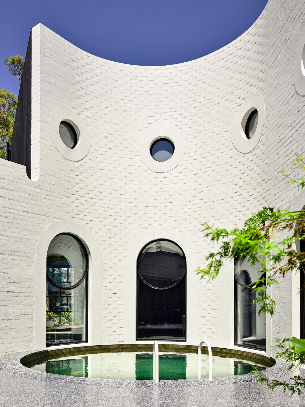 The circular swimming pool in the internal courtyard is one of the most inspired elements of the project. Photo: Derek Swalwell