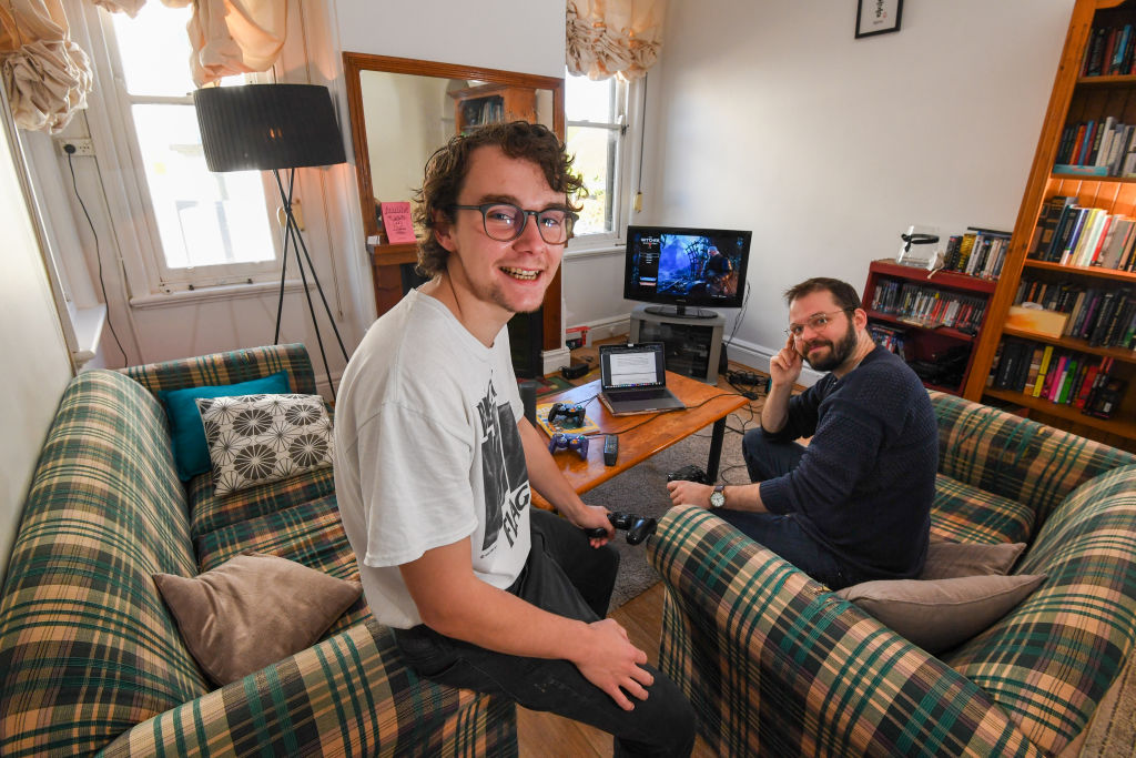 Liam Diviney, pictured with his flat mate Jimmy, is a 23-year-old student who was able to negotiate $30 off his weekly rent thanks to changing Sydney market conditions which now favour renters. Photo: Peter Rae