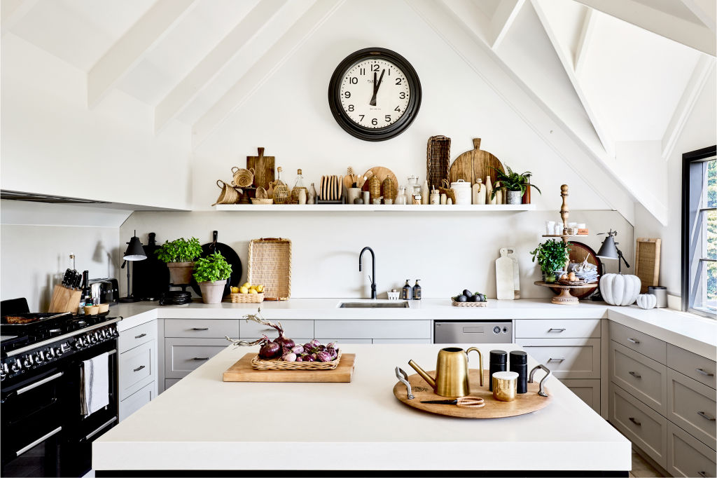 The kitchen, and the hub of the house. Where the long shelf now sits there was originally a large window, which Bruce and Chyka had to fill in for the renovation. Styling: Lucy Feagins. Photo: Amelia Stanwix