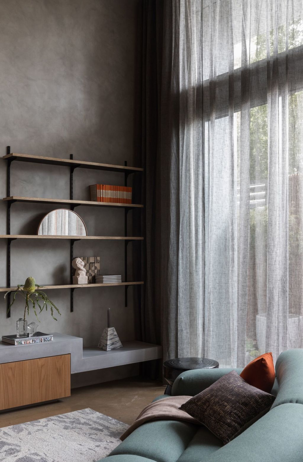 Concrete and curves highlight the contrasts in this sophisticated studio. Photo: Katherine Lu