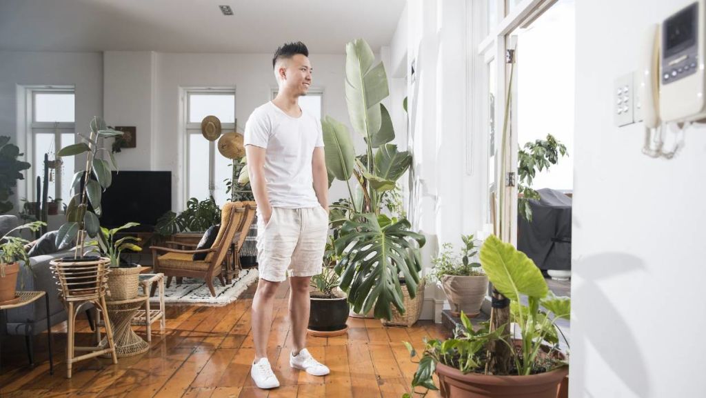 Plants are beautiful (and cheap!) space fillers that can make any room feel lush. Ron Goh likes his inner-city loft to feel like a house plant jungle. Photo: Chris McKeen/Homed