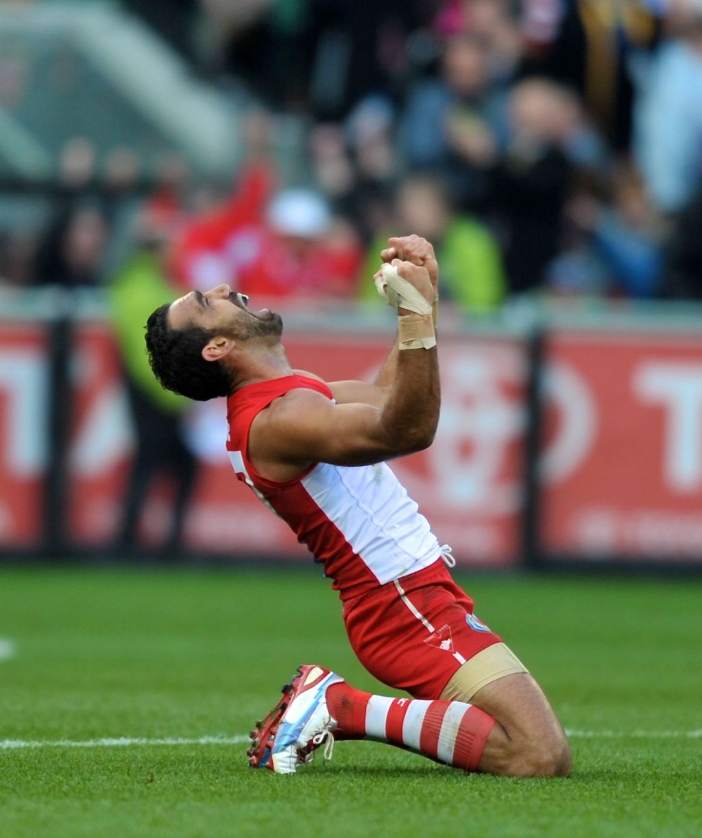 Adam Goodes erupts with passion at the Sydney Swans' 10-point win over Hawthorn in the 2012 AFL Grand Final. Photo: Wayne Taylor