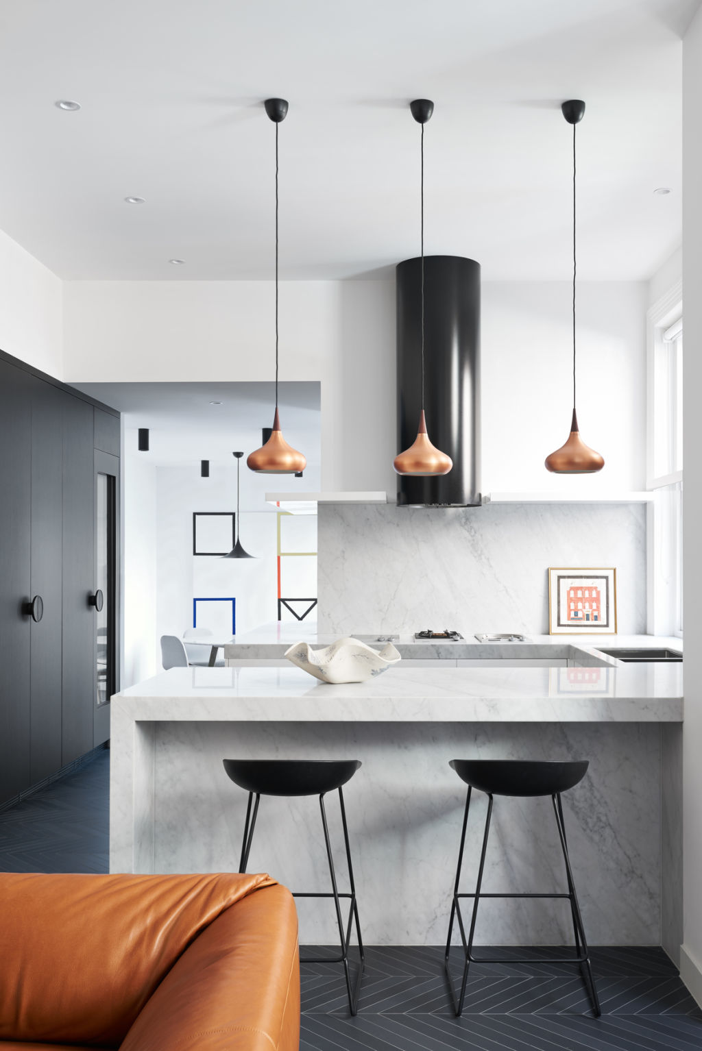Stone and timber hum beautifully alongside copper and brass fixtures.  Photo: Dan Hocking