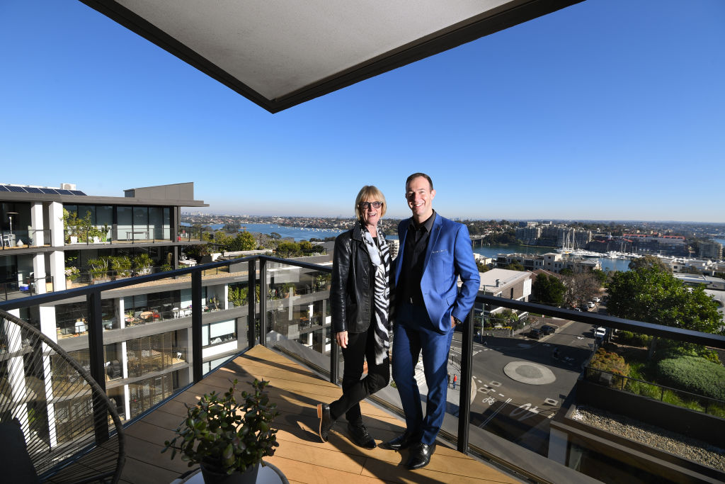 Happy buyer Eunice Markham on the left with her buyers agent Paul Simon from Multicon. Photo: Peter Rae