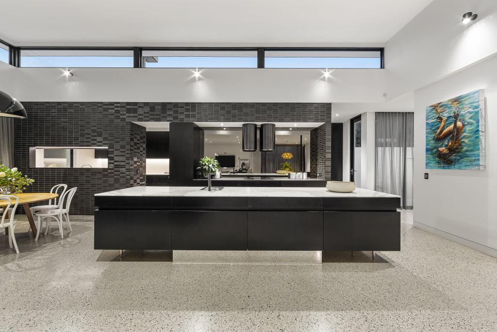 Calacutta marble bench-tops and the highest end of fittings in this kitchen. Photo: Buxton.