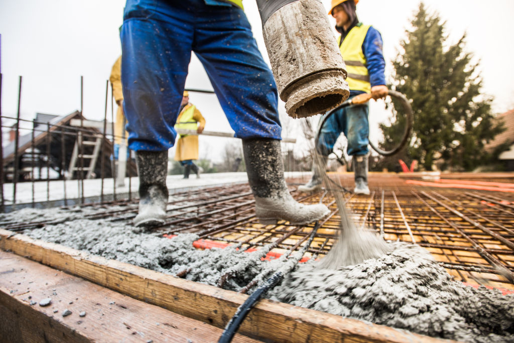 Concrete can be poured in the rain, but it's usually avoided. Photo: iStock