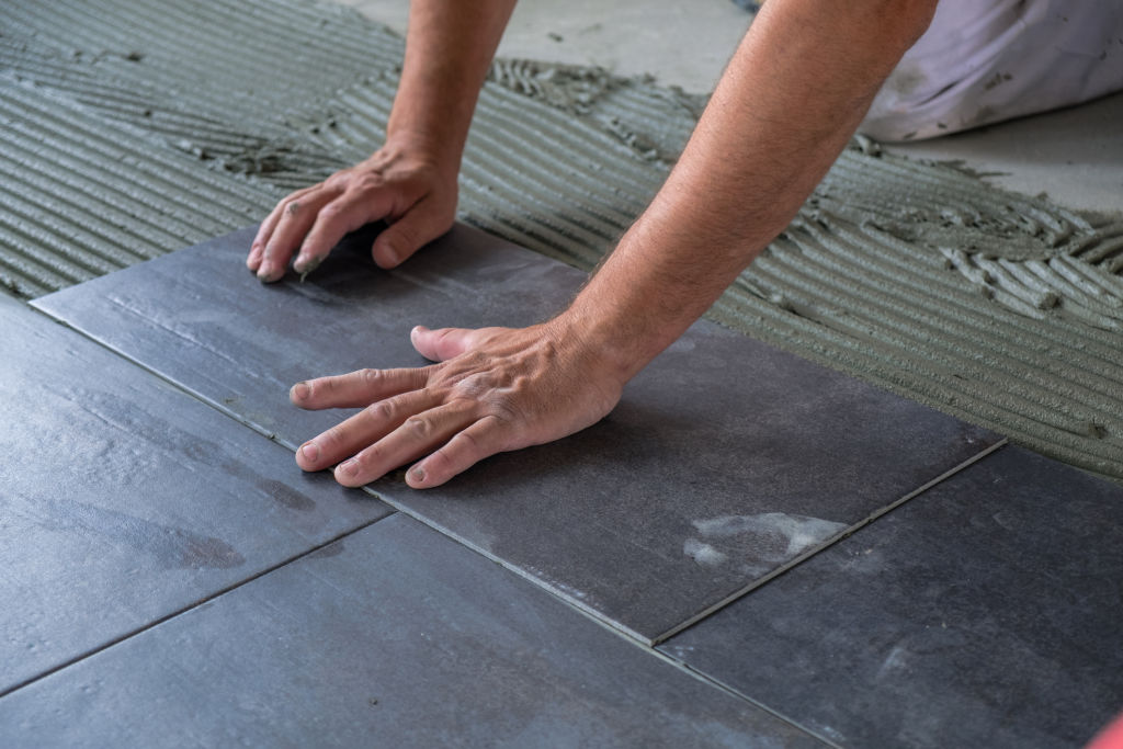 Tiling and plastering can take longer in winter because damp air means screeds and adhesives take longer to dry. Photo: iStock