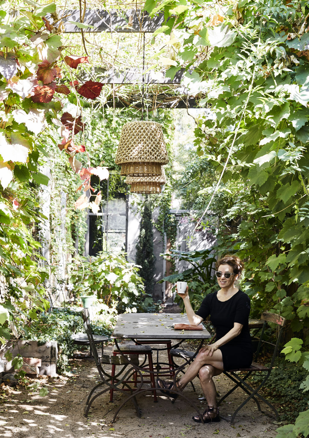 Barb in her lush European garden, which she created with the help of local landscaper Gavin Smith. Styling: Annie Portelli. Photo: Caitlin Mills