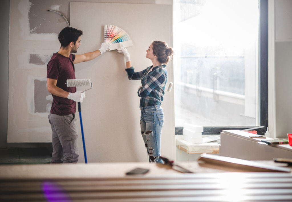 Once the wood is sanded and undercoated, you’ll need to decide if you’re going to brush, roll or spray on the paint colour. Photo: iStock