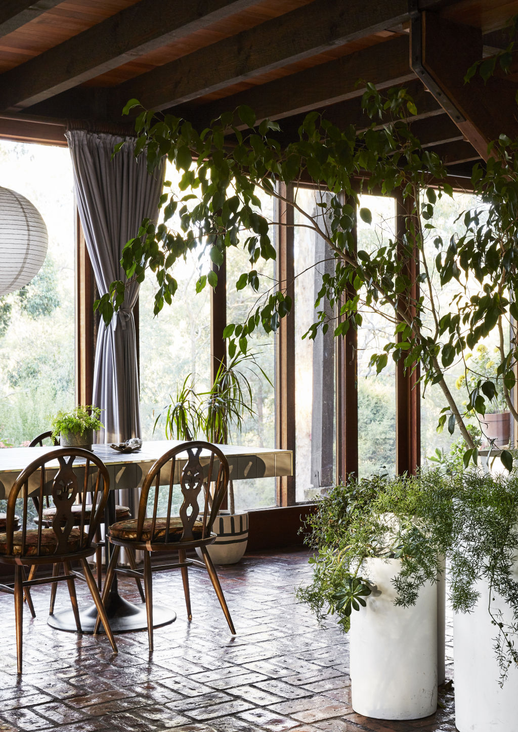 Plenty of indoor greenery creates a wonderful link between interior and exterior. Styling: Annie Portelli. Photo: Caitlin Mills