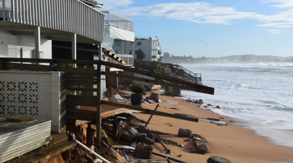 Living by the water is still the dream for many, even though they expect severe weather to increase. Pictured is the damage caused to waterfront homes on Sydney's northern beaches by a king tide in 2016. Photo: Nick Moir