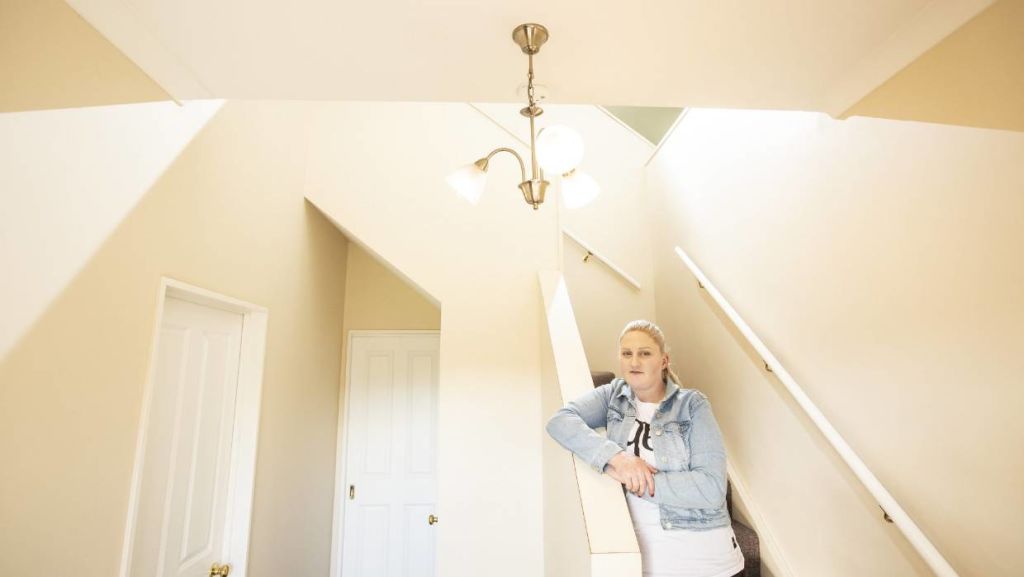 The double-height stairwell is a key sculptural feature within the house. Photo: Braden Fastier