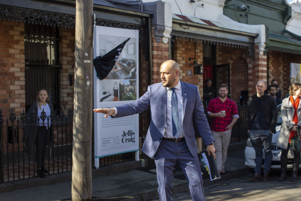 Sam Rigopolous auctioning the terrace. Photo: Stephen McKenzie