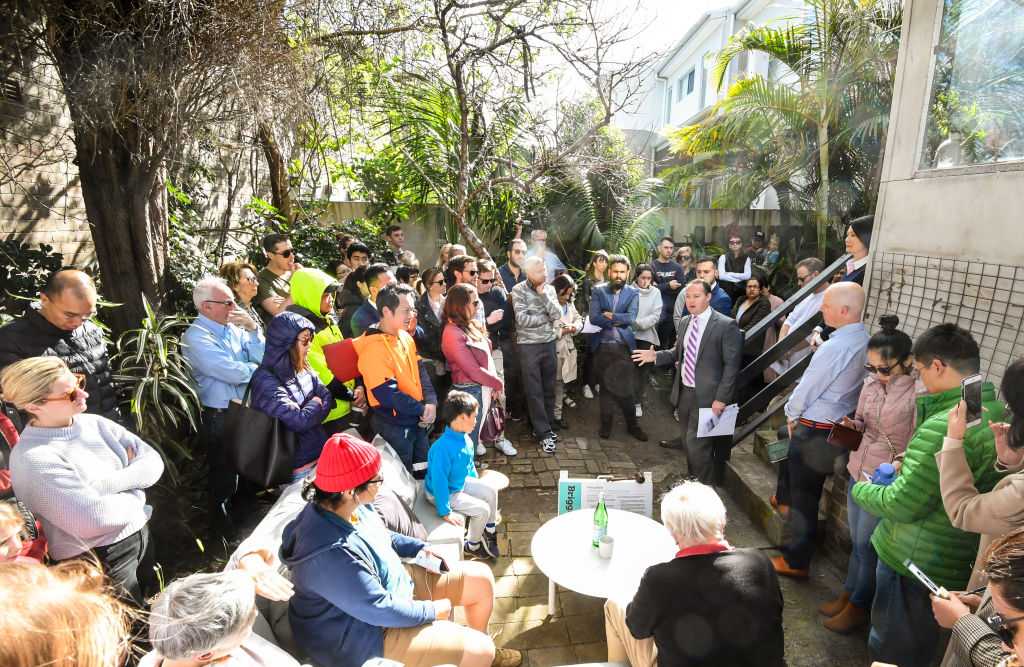The auction of 16 Old Canterbury Road, Lewisham, draws a big crowd. Photo: Peter Rae