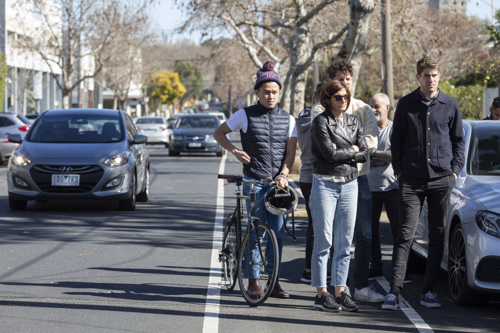 A gathered crowd watches on.  Photo: Stephen McKenzie