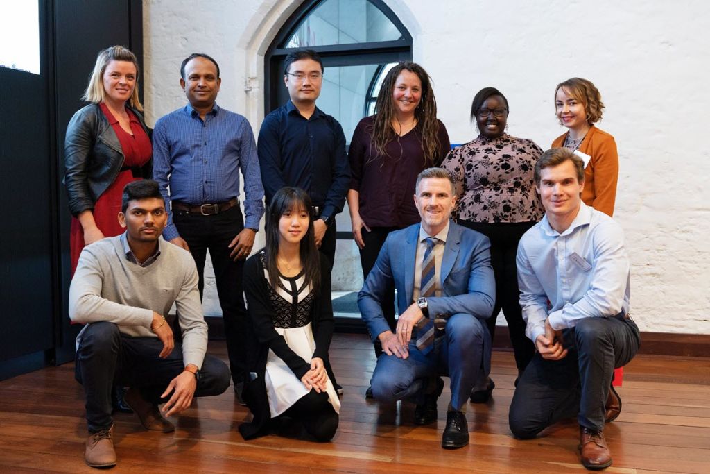 Lisa Halton, from Studio Halton (back left), Dr Jane Matthews from Curtin University (back row, third from right), Ryan Darcy, JLL state manager construction (front row, second from right) and the students from Curtin University.