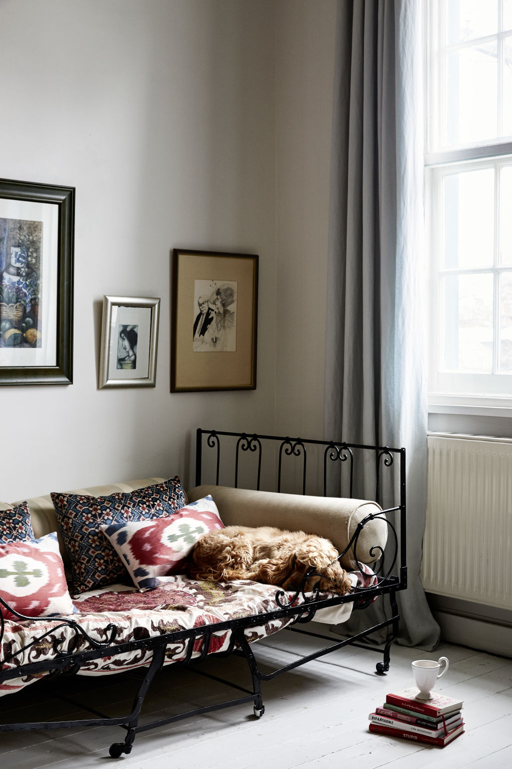 Early French folding bed purchase in L’Isle-sur-la-Sorgue, Tigger’s favourite antique shopping spot in France. Almaty Velvet black cushions by Carolina Irving. Painting by Tigger and Sue McCartney Space. Styling: Annie Portelli. Photo: Caitlin Mills