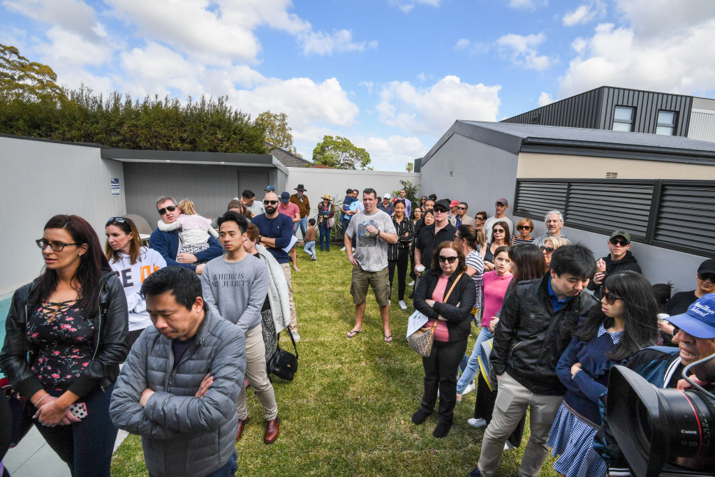 Close to 100 people and 10 registered bidders turned out for the auction of 11a Barney Street, Drummoyne. Photo: Peter Rae