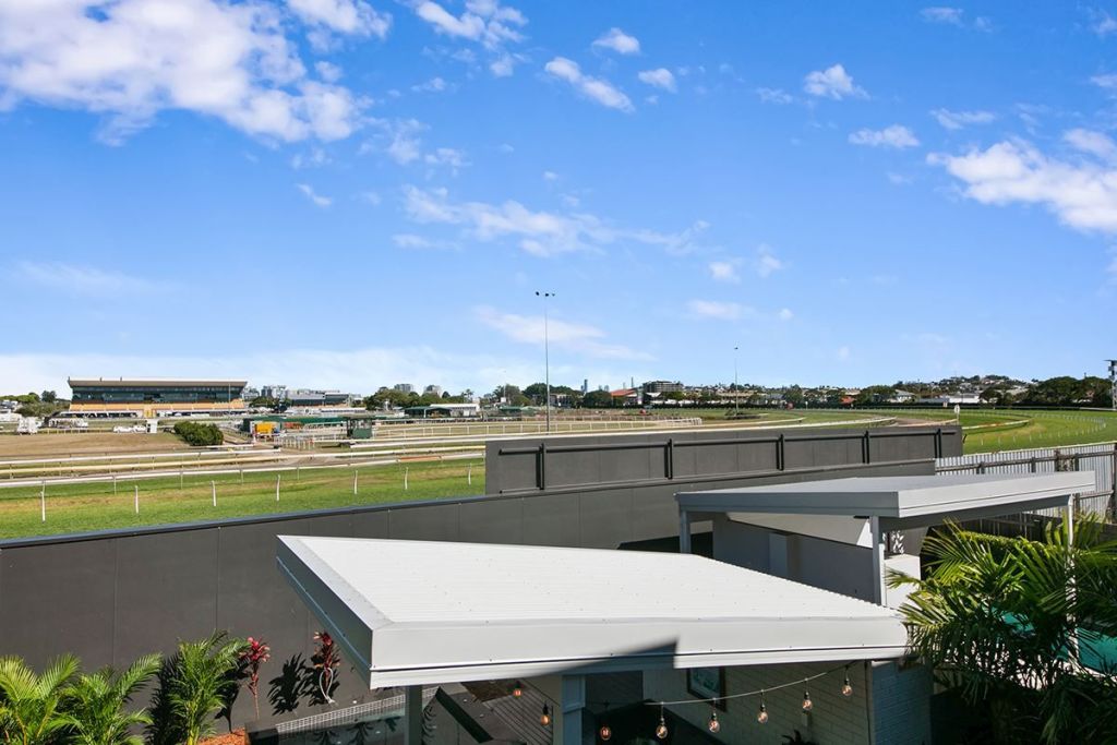 Properties like 45 Raceview Avenue Hendra, up for auction on Saturday, September 21, back onto Doomben Racecourse and get a front seat on race day. Photo: Harcourts Clayfield