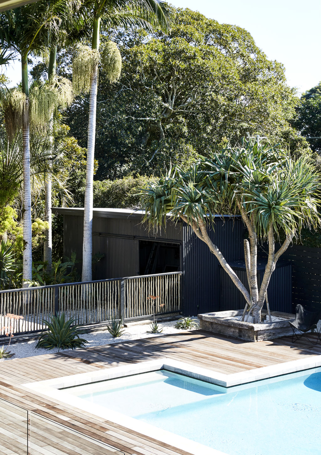 Magnesium pool surrounded by Merbau timber decking and Touchwood Trading pool fence. Styling: Annie Portelli. Photo: Caitlin Mills