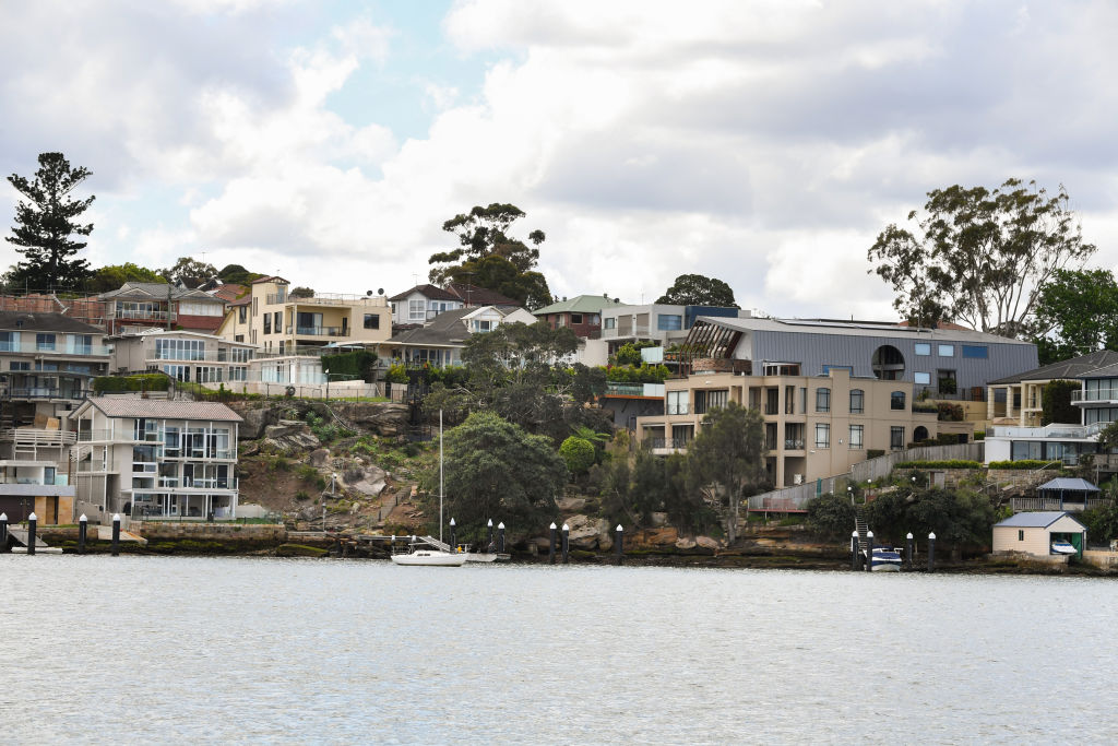 The prized waterfront setting near Looking Glass Point in Gladesville includes the waterfront block bought for $5.9 million and the Sabharwal's recently completed contemporary home (top right). Photo: Peter Rae