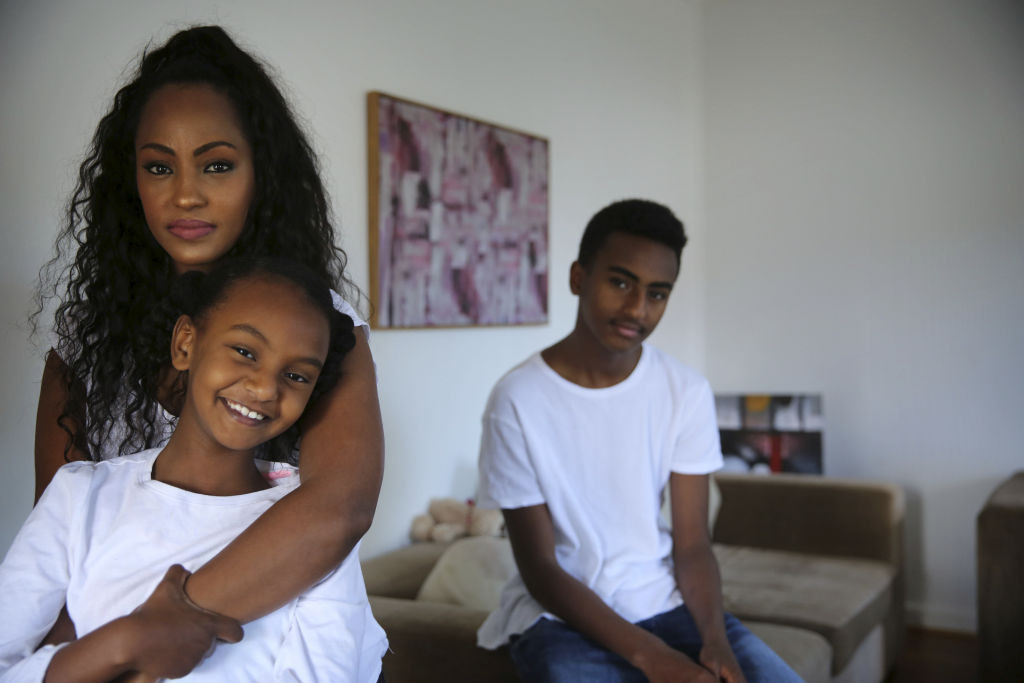 Feven Ayalew and her two children Bemnet, 8, and Befekir, 14, at their home in Western Sydney. Photo: James Alcock