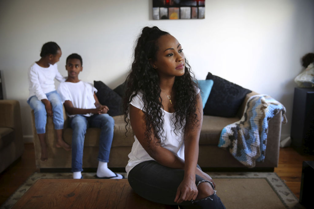 Feven Ayalew and her two children Befekir, 14, and Bemnet, 8, at their home in Western Sydney. Photo: James Alcock