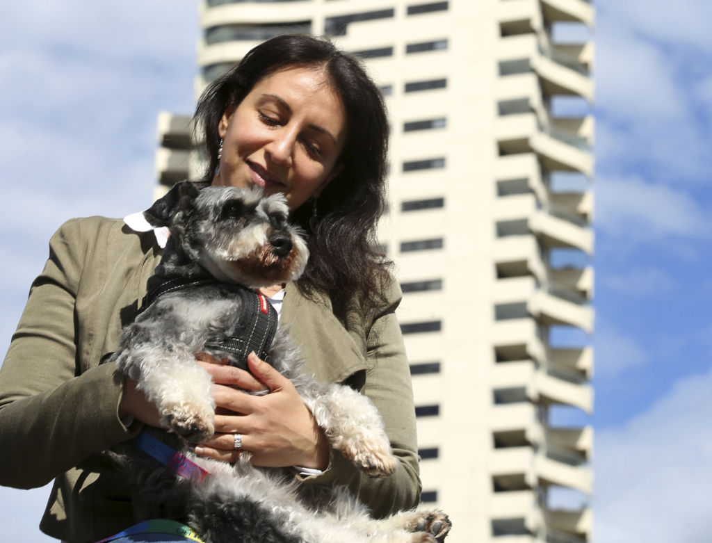 Horizon apartments resident Jo Cooper with her miniature schnauzer, Angus, now faces having to leave her home, get rid of Angus or put him down. Photo: James Alcock