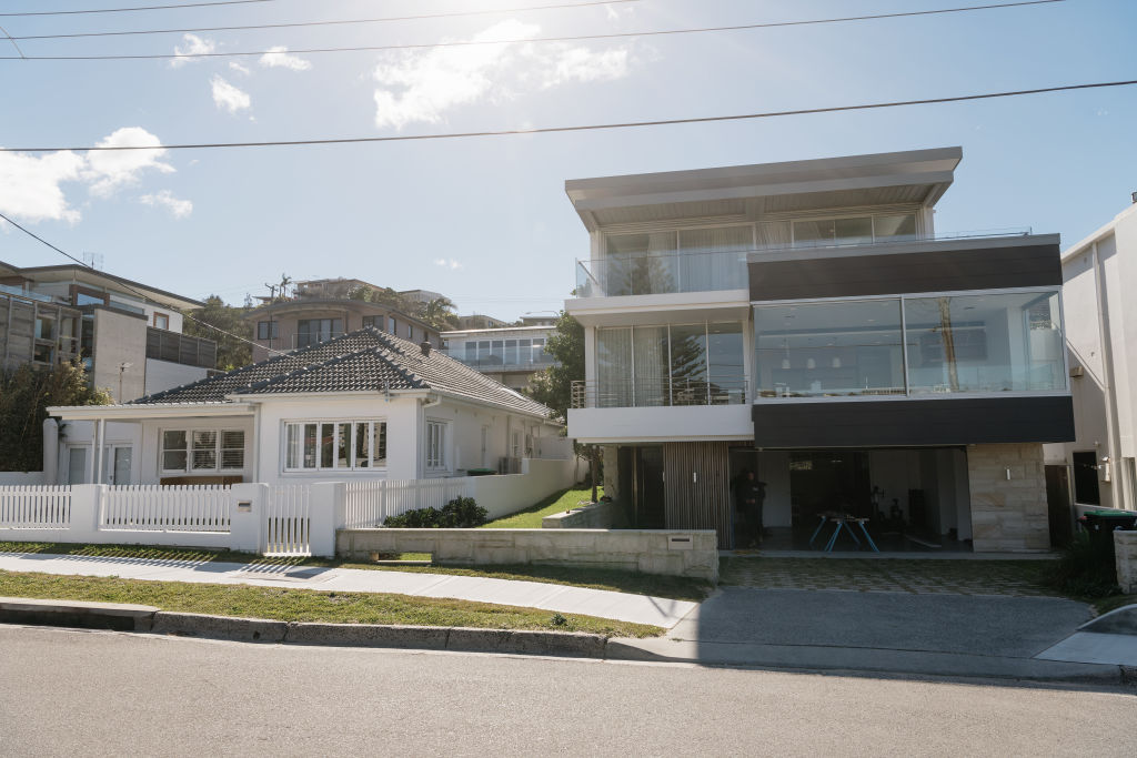 Adam Gilchrist owns these neighbouring homes in Freshwater. He set a suburb high when he purchased the three-level property (pictured right) for $14 million. Photo: James Brickwood