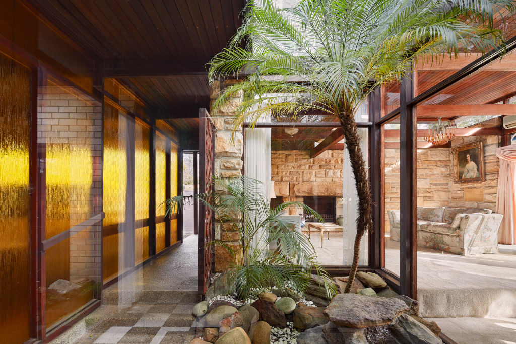 The home is in near-mint condition with a sandstone feature wall and fireplace. Photo: Supplied.