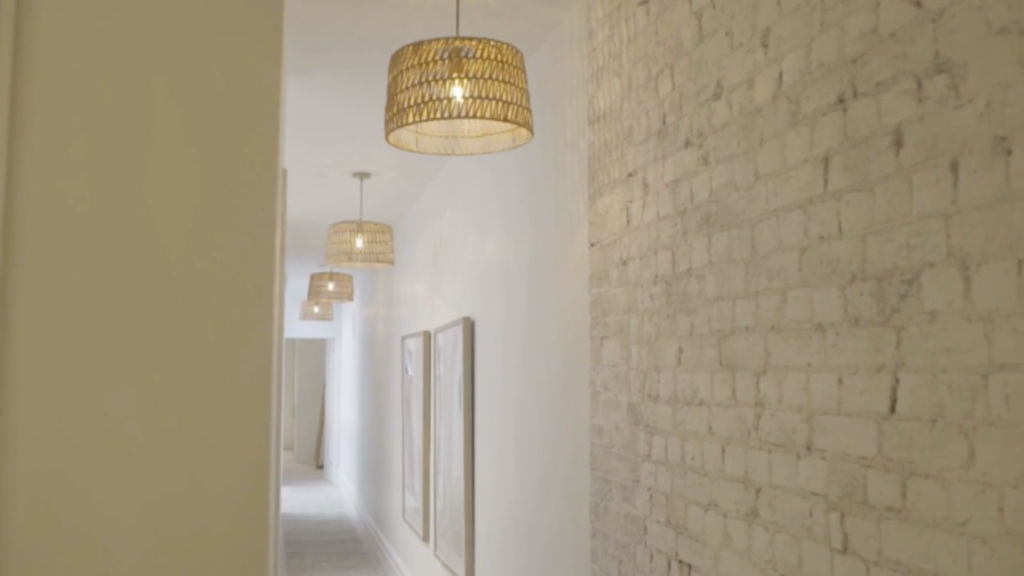 Andy and Deb's hallway. The exposed brick was great, but the exposed architraves? Not so much. Photo: Channel Nine