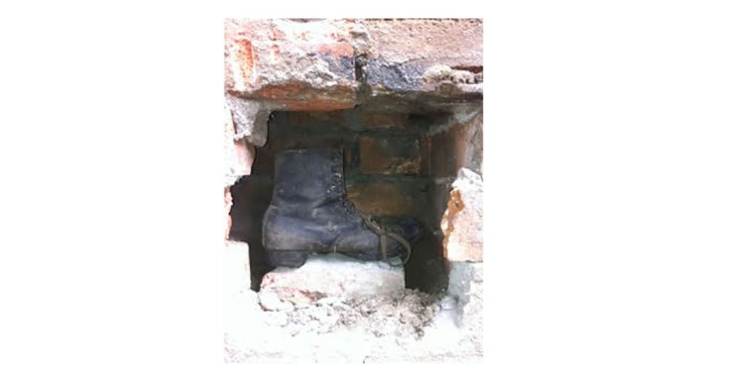 A witch's boot was intentionally built into the wall, in the belief it warded off evil spirits. Photo: Supplied
