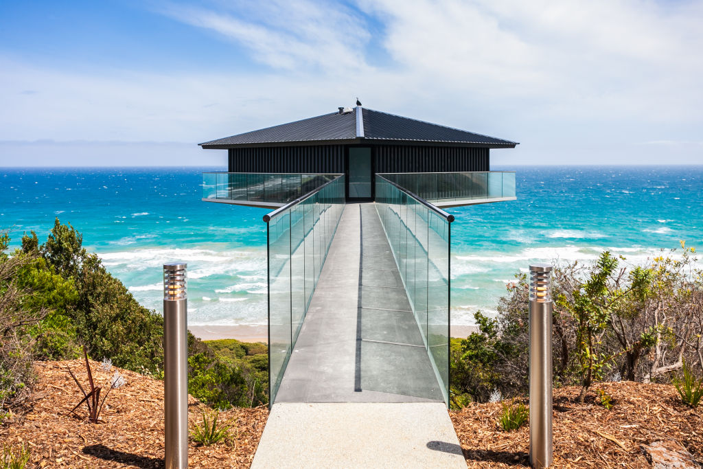 The Pole House is suspended 40 metres above Fairhaven Beach. Photo: Matt Lord