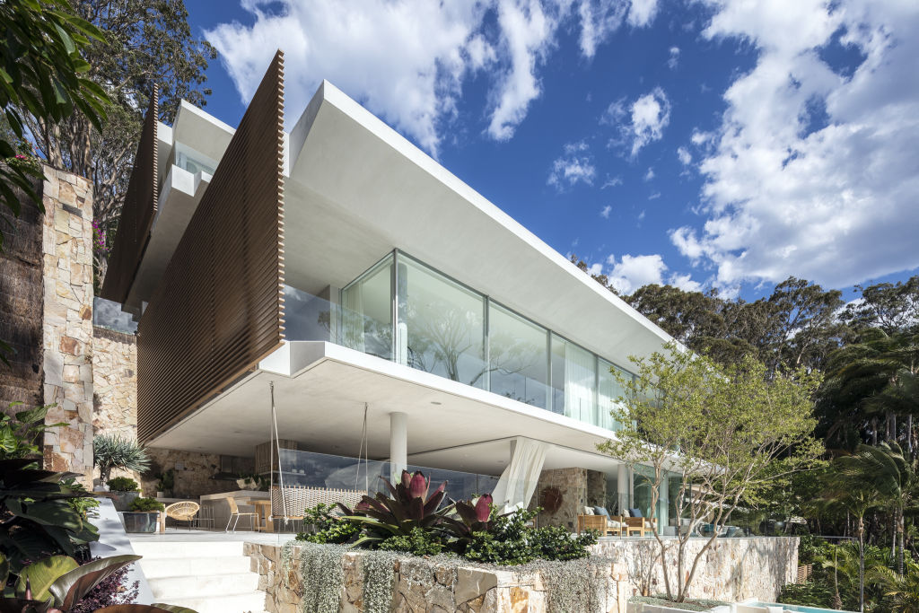 There are cantilevered verandahs that overlook a sunken lounge by the swimming pool. Photo: Supplied