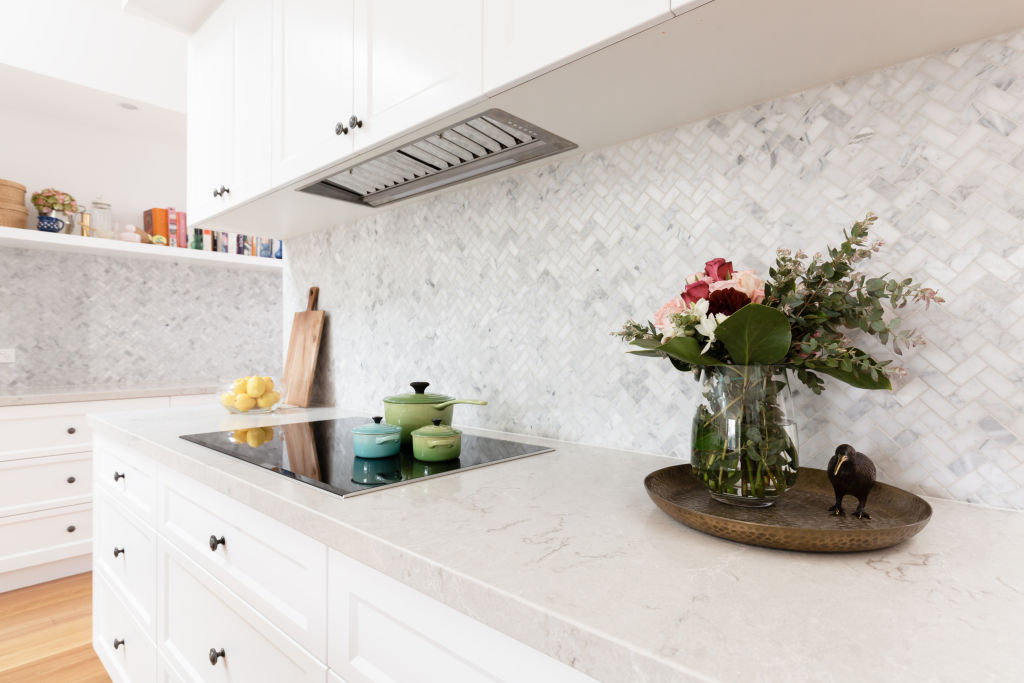 A light Caesarstone bench can brighten up the room. Photo: iStock