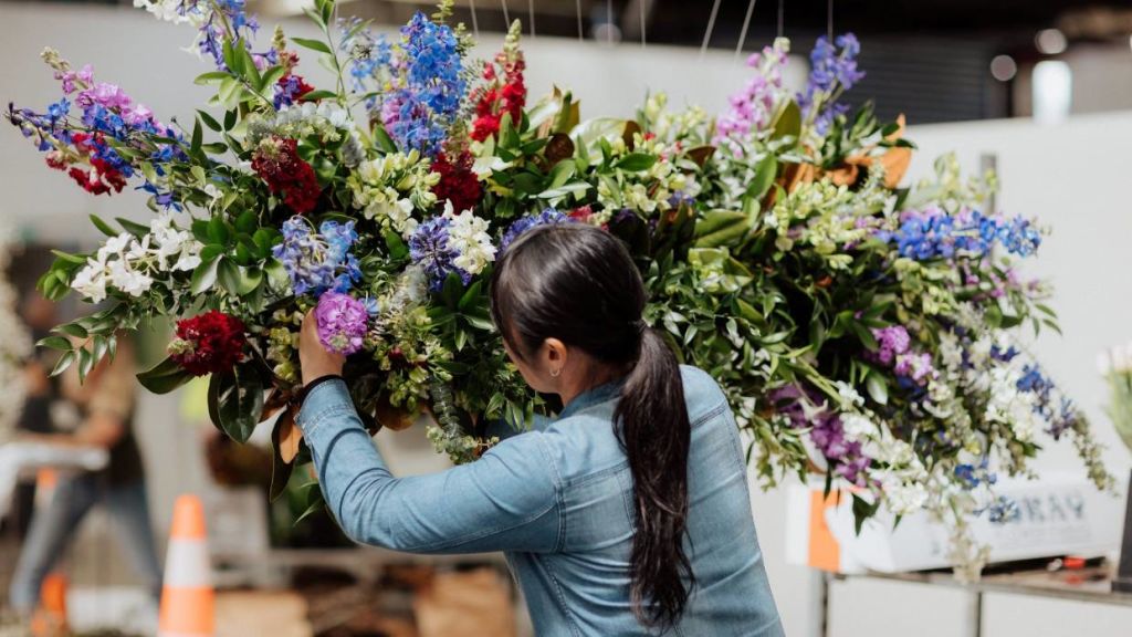 Shiraki worked on a large public floral display to highlight Flowers Week. Photo: Homed