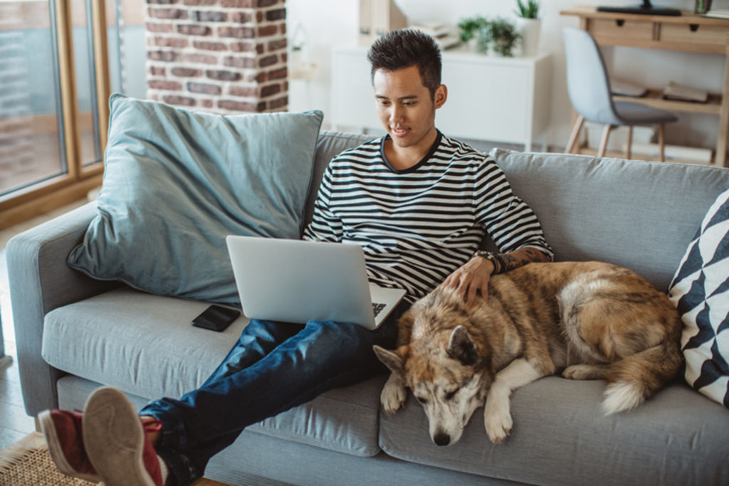 But 'more often than not I’m plugging away on the couch, with my laptop resting on my lap'. Photo: iStock