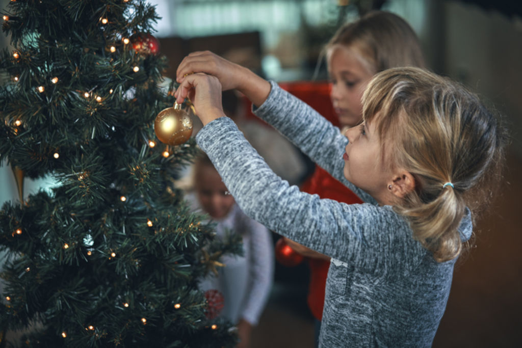 I’ve outsourced Christmas tree decorating to the kids in our family for the past few years, encouraging them to go crazy with mismatched colour. Photo: iStock