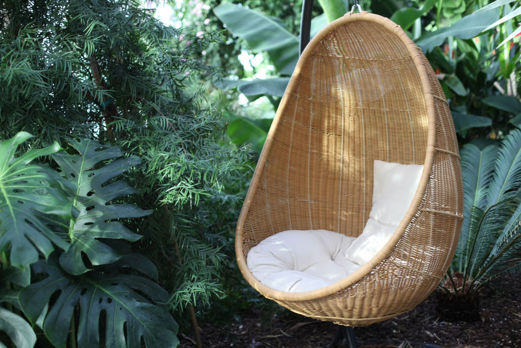 Brown wicker furniture is a timeless addition to an outdoor entertaining area. Photo: iStock