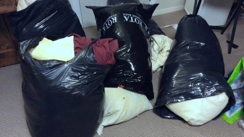 A two-metre-high stack of bedding was reduced to a few bags. Charity recycling bins were the winners. Photo: Nick Barnett