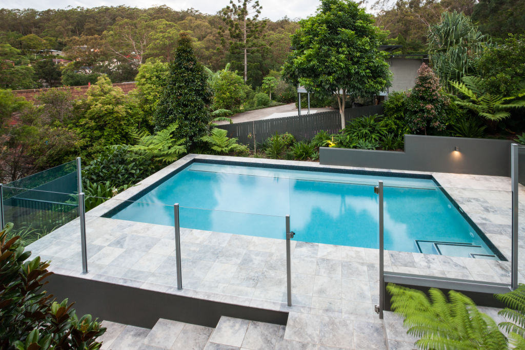 The type of landscaping material and how much of it is needed to create a level base can increase installation costs.  Photo: Bluehaven Pools