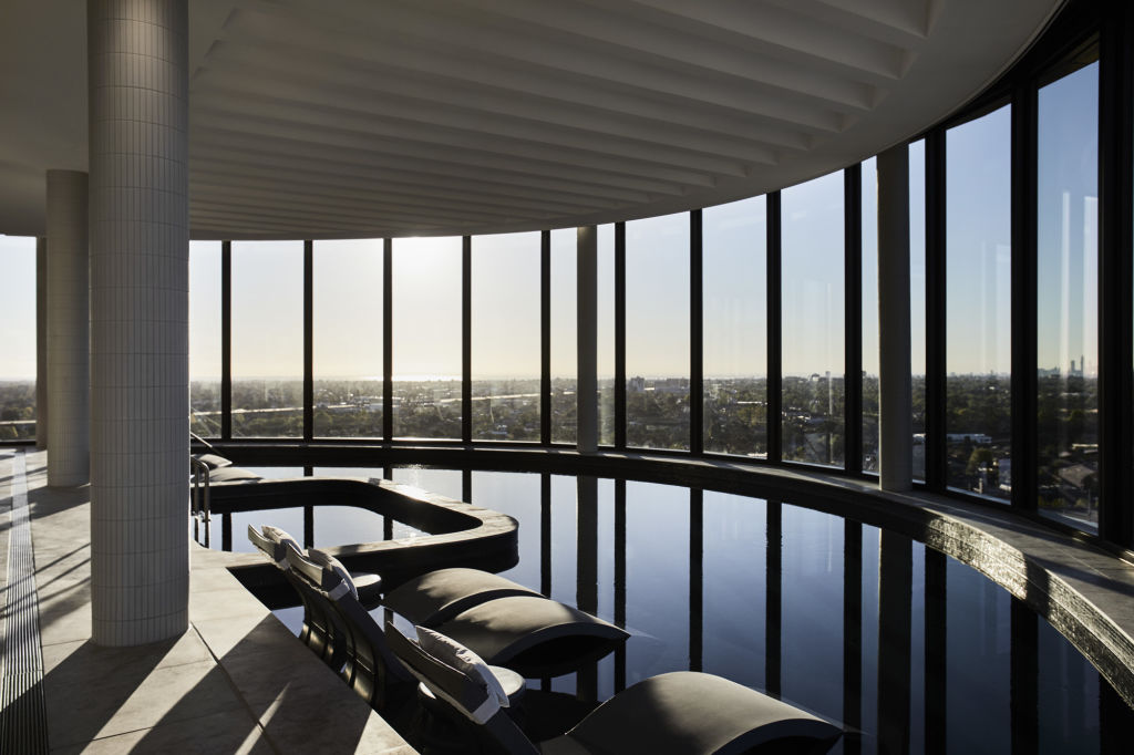 The sun set from the 12th floor Hotel Chadstone pool, with aquatic lounges. Photo: Hotel Chadstone/Accor