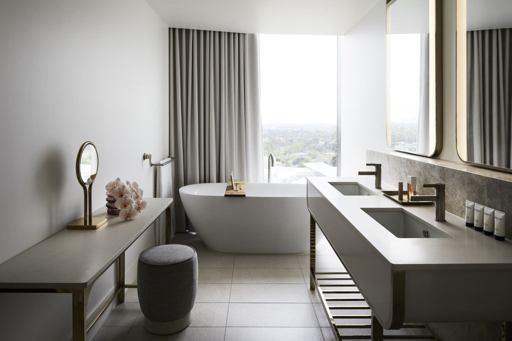 A freestanding bath overlooks the city. Photo: Hotel Chadstone/Accor