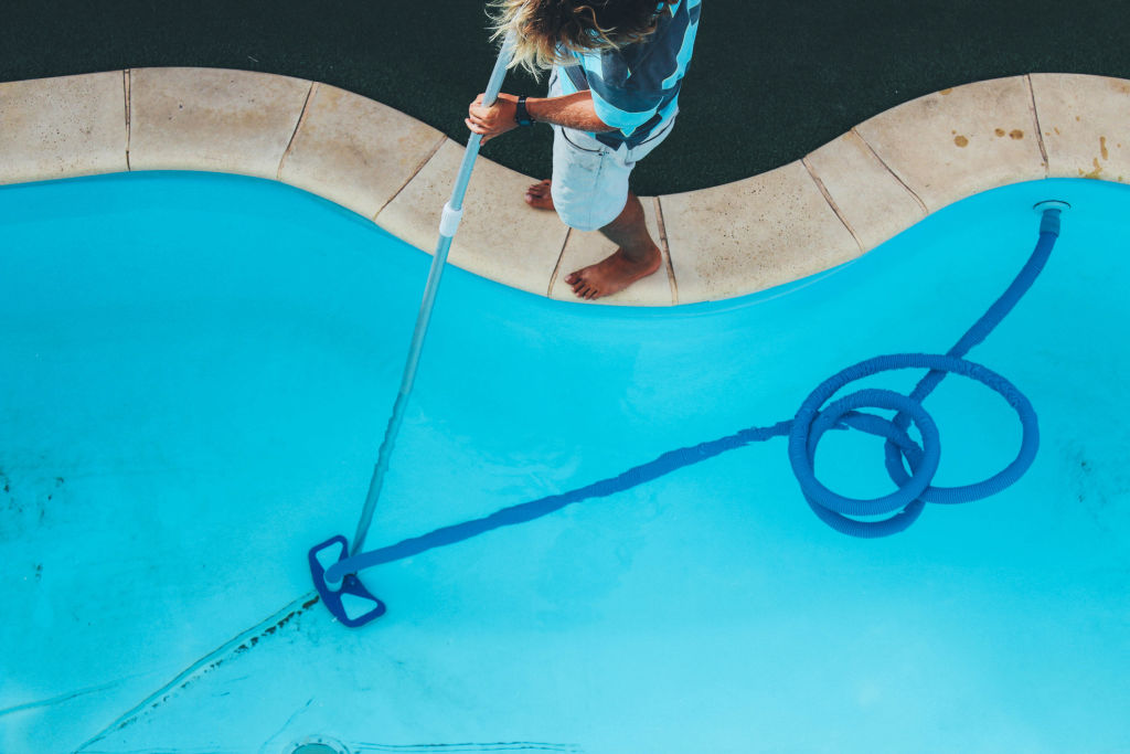 Vacuuming regularly will help keep the pool in a swimmable state. Photo: iStock