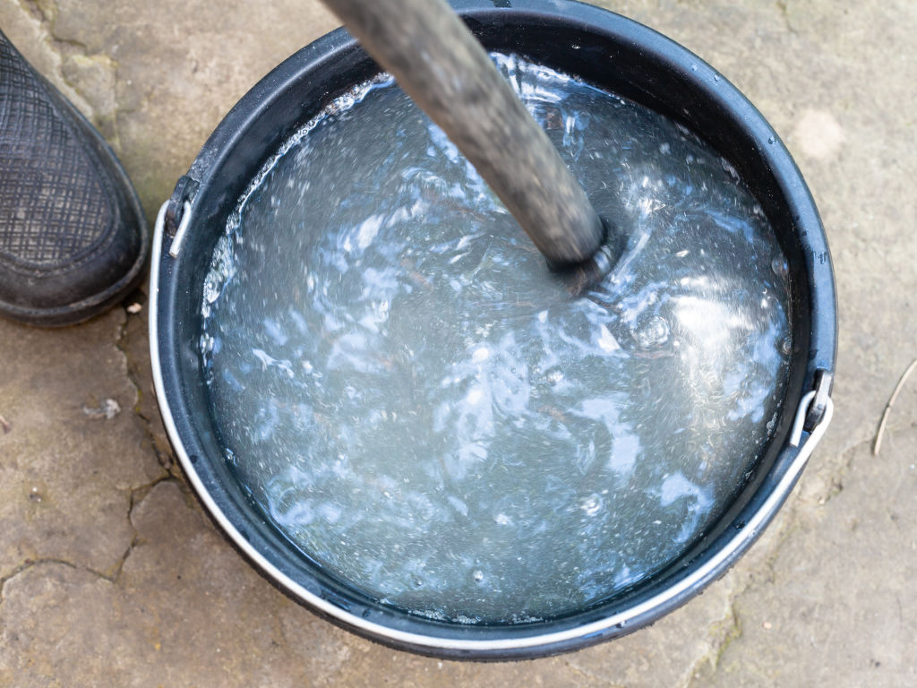 Mix chlorine with water before adding to the pool. Photo: iStock