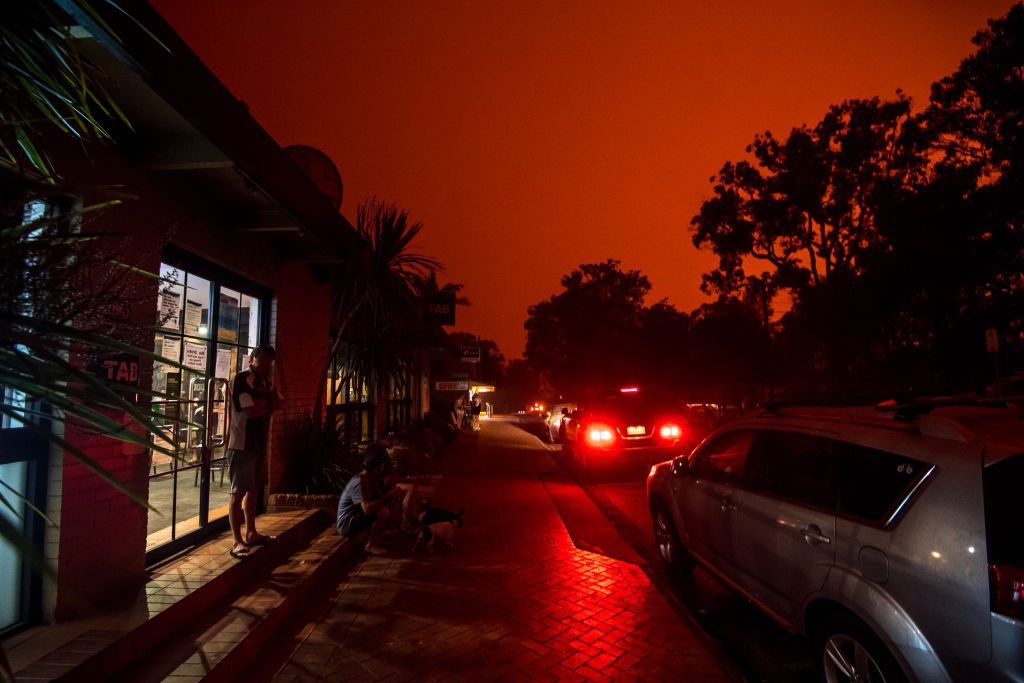 Mallacoota on January 3, when day again turned to a blood red sky in Mallacoota with a wind change sparking fire activity in the area. Photo: Justin McManus
